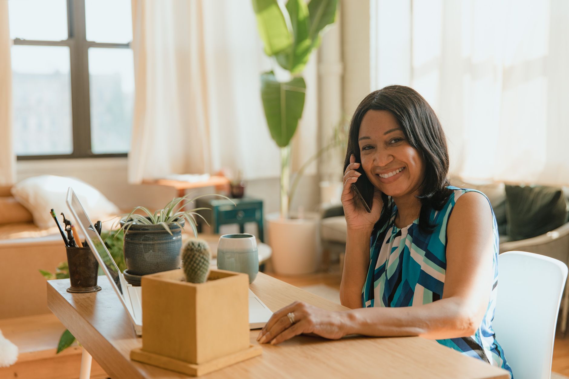 A phone and laptop on a small business front desk