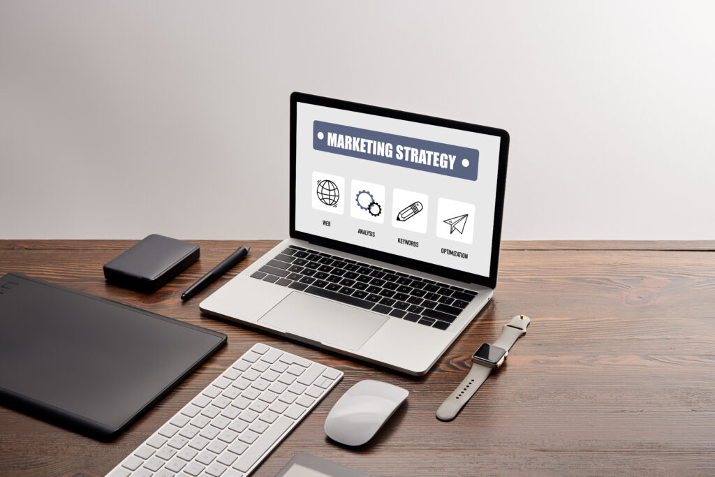 Marketing strategy planning with laptop and gadgets on desk